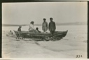 Image of Herbert Decker's family in boat on sledge